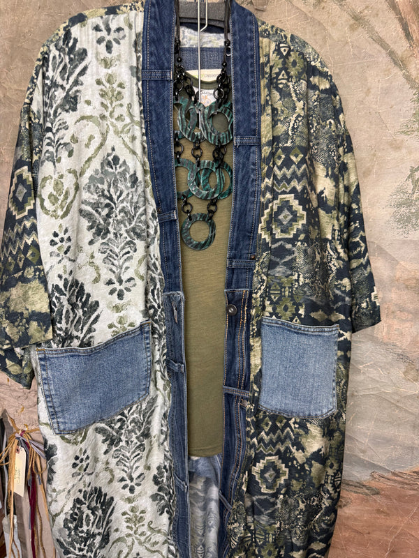Boho patchwork denim cardigan with floral and aztec prints, large patch pockets, open front, styled with green necklace - 10