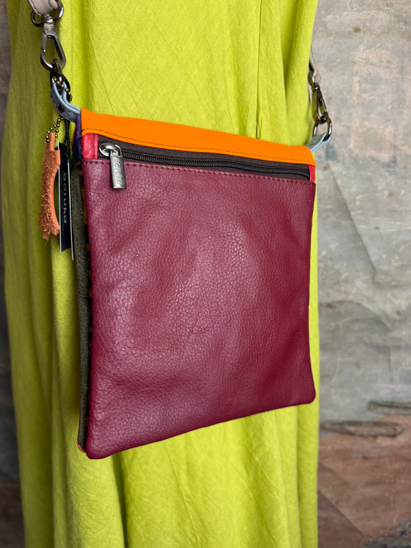 Soruka burgundy leather crossbody bag with orange trim and silver zipper, colorblock mini purse with chain strap - 1