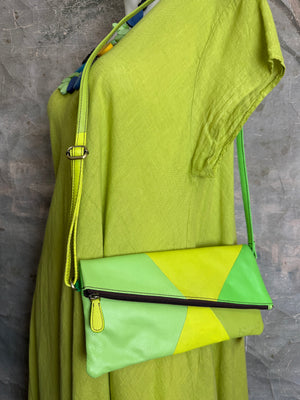 Sotfuko Mila crossbody bag in lime green patchwork leather with yellow accents and adjustable strap on mannequin - 1