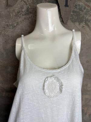White flowy spaghetti strap cami tank top with raw lace rosette detail, paired with patchwork denim leggings - 2