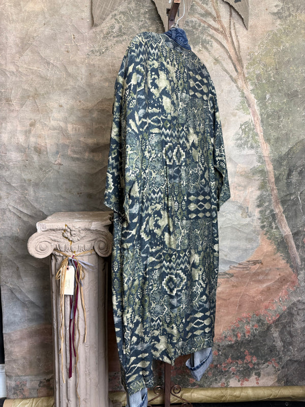 Boho patchwork denim cardigan with floral and aztec prints, large patch pockets, open front, styled with green necklace - 8