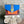 Load image into Gallery viewer, Goruka Grace Reversible Loop-B colorblock leather bag in blue, burgundy, orange with zebra print strap on stone column - 1
