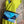 Load image into Gallery viewer, Mila color-block crossbody bag in teal, blue, and navy leather with turquoise strap, styled on mannequin with lime dress - 9
