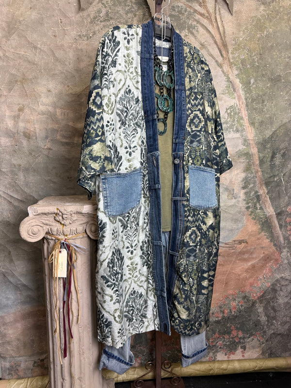Boho patchwork denim cardigan with floral and aztec prints, large patch pockets, open front, styled with green necklace - 13