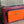 Load image into Gallery viewer, Goruka Grace Reversible Loop-B colorblock leather bag in blue, burgundy, orange with zebra print strap on stone column - 3
