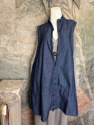 Long denim zip-front sleeveless vest with drawstring hem displayed on mannequin, boutique Merritt style - 1