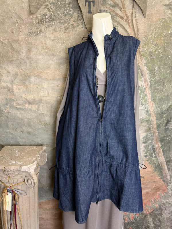 Long denim zip-front sleeveless vest with drawstring hem displayed on mannequin, boutique Merritt style - 1