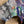 Load image into Gallery viewer, Oversized crew pullover in vibrant multicolor abstract print with flower necklace, paired with black pants on mannequin - 3
