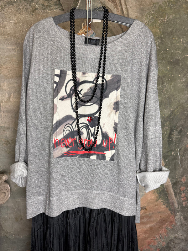 Gray heather Never Grow Up graphic sweatshirt top styled with black crinkle maxi skirt and beaded necklace - 4