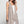 Load image into Gallery viewer, Long black sleeveless open front duster vest styled with graphic tee, gingham pants, and black beaded necklace on hanger - 13
