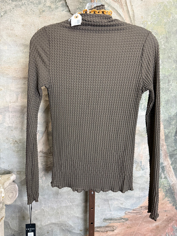 Olive green waffle knit turtleneck long sleeve fitted top displayed with chunky beaded statement necklace on hanger - 7