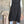 Load image into Gallery viewer, Long black sleeveless open front duster vest styled with graphic tee, gingham pants, and black beaded necklace on hanger - 7
