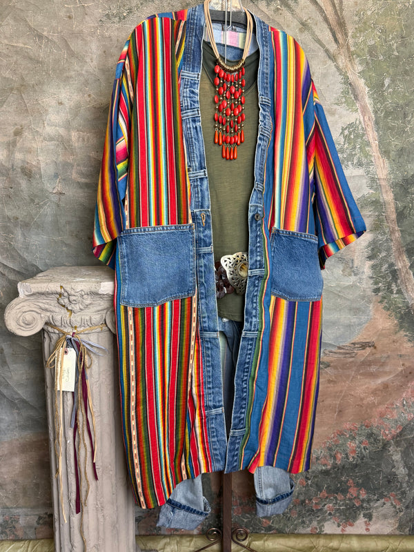 Boho serape striped duster cardigan with denim pockets, styled with red bead necklace and belt on mannequin - 2