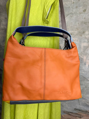 Soruka orange multicolor leather crossbody bag with gray strap on lime green linen dress mannequin - 2