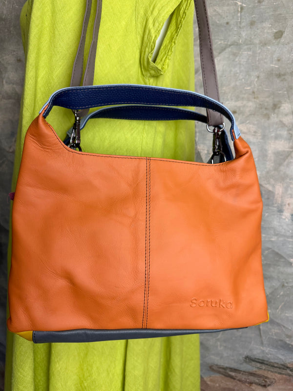 Soruka orange multicolor leather crossbody bag with gray strap on lime green linen dress mannequin - 2