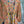 Load image into Gallery viewer, Woman wearing DYM90081 Bloomspell Maxi Dress in orange floral print with pink Converse sneakers in boutique setting - 7
