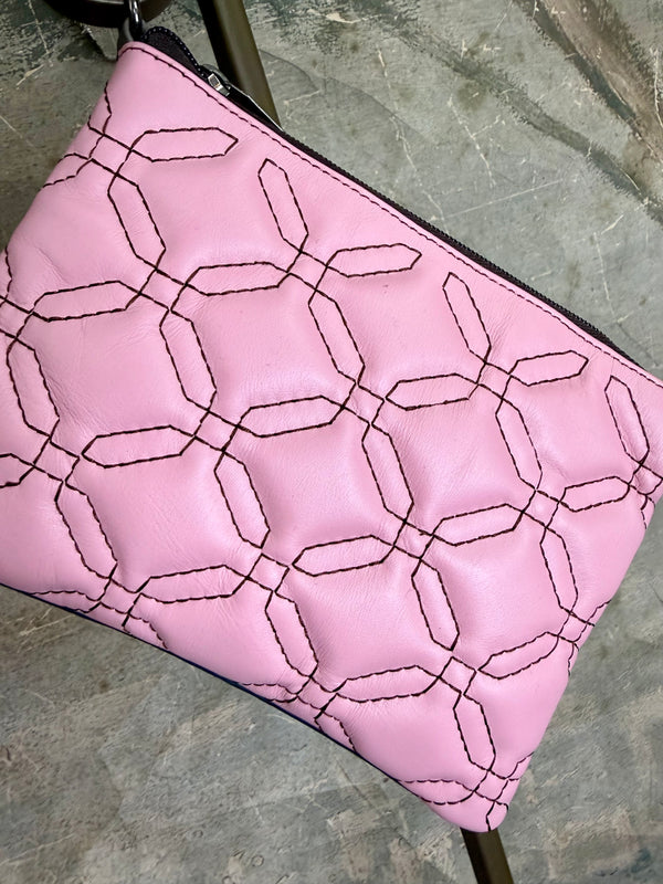 Pink leather quilted crossbody bag with geometric stitching pattern and black adjustable strap on lime green dress - 8