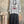 Load image into Gallery viewer, Gray heather Never Grow Up graphic sweatshirt top styled with black crinkle maxi skirt and beaded necklace - 1
