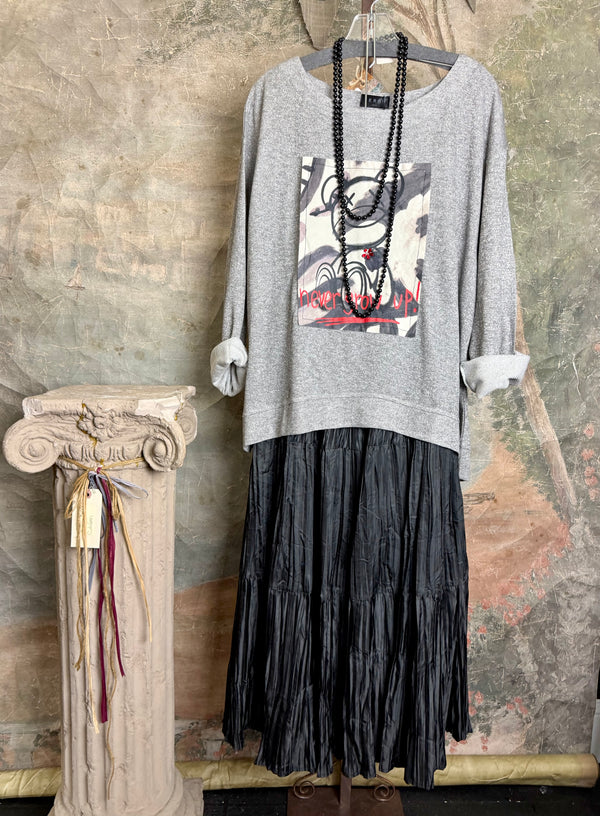 Gray heather Never Grow Up graphic sweatshirt top styled with black crinkle maxi skirt and beaded necklace - 1