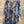Load image into Gallery viewer, Oversized crew pullover in vibrant multicolor abstract print with flower necklace, paired with black pants on mannequin - 6
