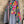 Load image into Gallery viewer, Fiesta denim boyfriend shirt with vibrant multicolor floral embroidery on chambray blue, displayed on hanger with pink l - 2
