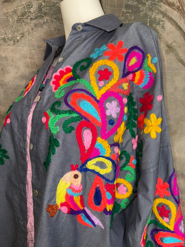 Fiesta denim boyfriend shirt with vibrant multicolor floral embroidery on chambray blue, displayed on hanger with pink l - 3
