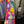 Load image into Gallery viewer, Fiesta denim boyfriend shirt with vibrant multicolor floral embroidery on chambray blue, displayed on hanger with pink l - 4
