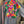 Load image into Gallery viewer, Fiesta denim boyfriend shirt with vibrant multicolor floral embroidery on chambray blue, displayed on hanger with pink l - 6
