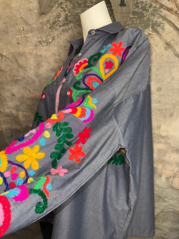 Fiesta denim boyfriend shirt with vibrant multicolor floral embroidery on chambray blue, displayed on hanger with pink l - 7