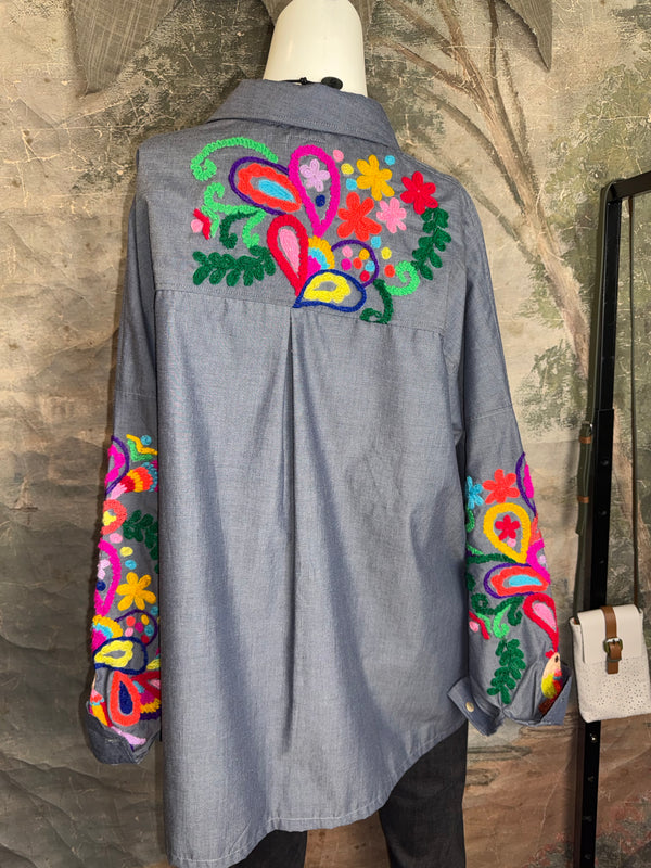 Fiesta denim boyfriend shirt with vibrant multicolor floral embroidery on chambray blue, displayed on hanger with pink l - 8