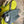 Load image into Gallery viewer, Gray leather shoulder bag with drawstring closure displayed on mannequin wearing lime green dress and colorful beaded ne - 6
