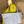 Load image into Gallery viewer, Gray leather shoulder bag with drawstring closure displayed on mannequin wearing lime green dress and colorful beaded ne - 16
