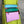 Load image into Gallery viewer, Colorblock crossbody bag in teal, green, and pink with zip pockets on lime green dress mannequin - 4

