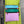Load image into Gallery viewer, Colorblock crossbody bag in teal, green, and pink with zip pockets on lime green dress mannequin - 7
