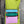 Load image into Gallery viewer, Colorblock crossbody bag in teal, green, and pink with zip pockets on lime green dress mannequin - 8
