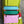 Load image into Gallery viewer, Colorblock crossbody bag in teal, green, and pink with zip pockets on lime green dress mannequin - 10
