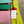 Load image into Gallery viewer, Colorblock crossbody bag in teal, green, and pink with zip pockets on lime green dress mannequin - 11
