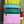 Load image into Gallery viewer, Colorblock crossbody bag in teal, green, and pink with zip pockets on lime green dress mannequin - 17

