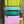 Load image into Gallery viewer, Colorblock crossbody bag in teal, green, and pink with zip pockets on lime green dress mannequin - 18
