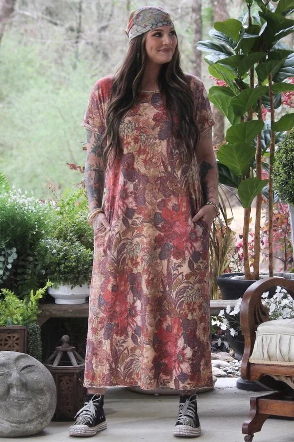Woman wearing JG Weekend Wander floral maxi T-shirt dress with boho headband and black high-top sneakers