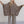 Load image into Gallery viewer, Woman wearing oversized brown ribbed knit tunic top with wide sleeves paired with leopard print wide-leg pants - 1
