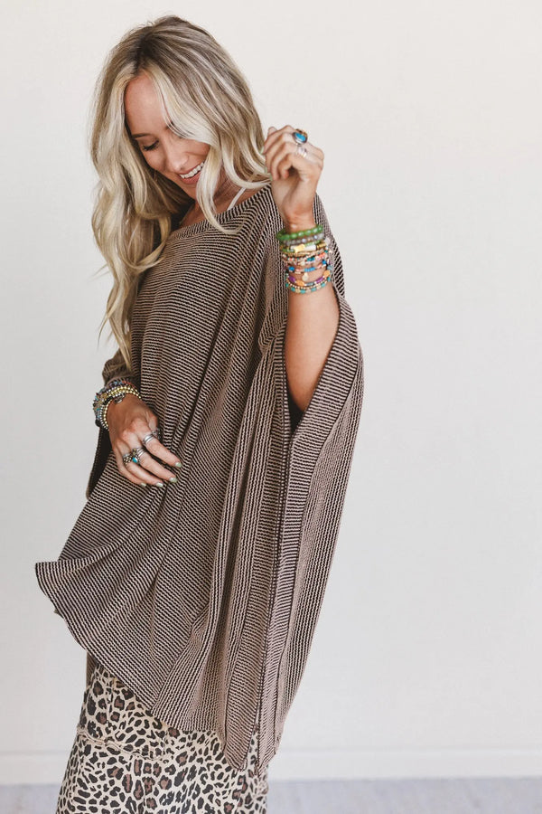 Woman wearing oversized brown ribbed knit tunic top with wide sleeves paired with leopard print wide-leg pants - 3