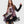 Load image into Gallery viewer, Woman wearing ET136M Fabulous Tunic Top with dark floral print, sheer black lace sleeves, and layered hem - 1
