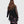 Load image into Gallery viewer, Woman wearing ET136M Fabulous Tunic Top with dark floral print, sheer black lace sleeves, and layered hem - 4

