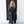 Load image into Gallery viewer, Woman wearing TBN3980 Comfort Jumpsuit in charcoal gray, long sleeve wide leg style with button front detail - 1
