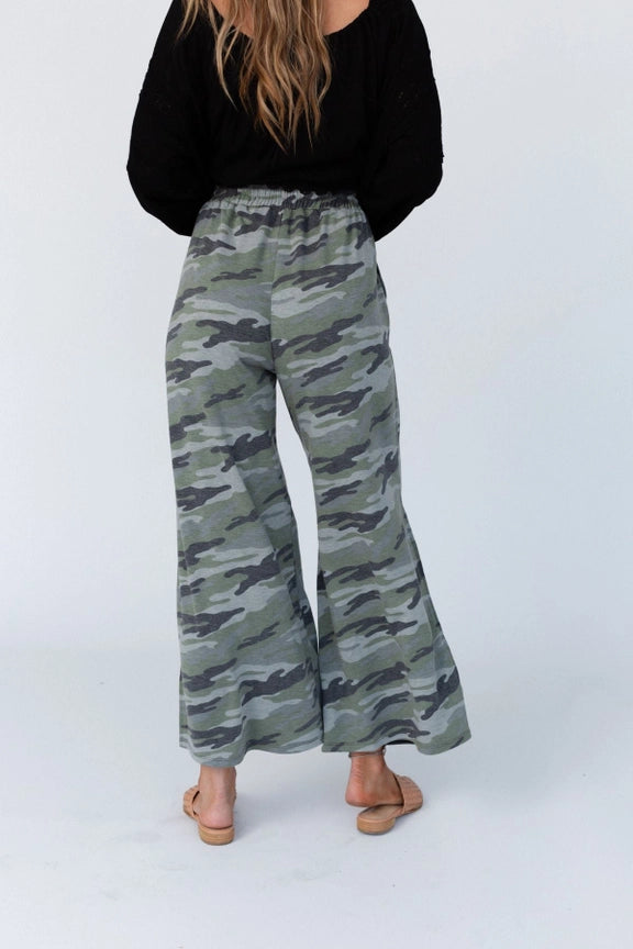 Woman wearing TBN6292 Wanderer Wide Leg Camo Pants with black top and layered necklaces, wide leg silhouette - 3