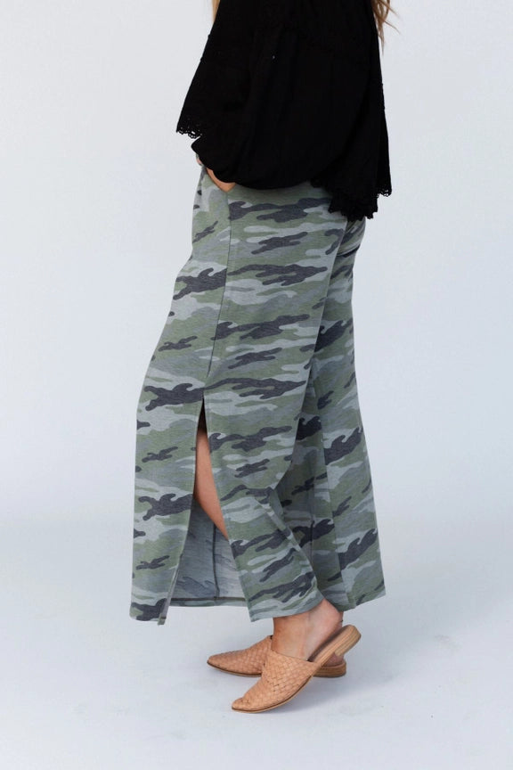 Woman wearing TBN6292 Wanderer Wide Leg Camo Pants with black top and layered necklaces, wide leg silhouette - 2