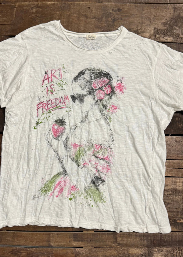 White vintage-style Art is Freedom graphic tee with floral woman and strawberry print on rustic wood background - 1