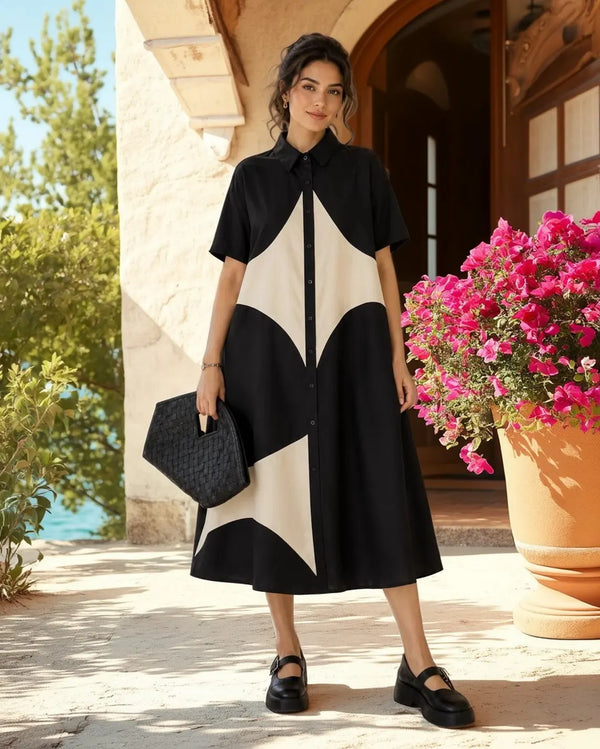 Woman wearing black and cream colorblock button-down midi shirt dress with geometric pattern and short sleeves - 4